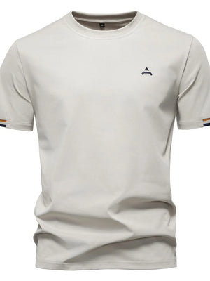 Beige t-shirt with embroidered crest detail and striped sleeve cuffs