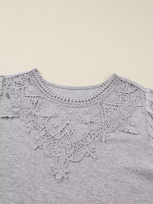 Gray ribbed knit long-sleeve top with intricate lace neckline detail