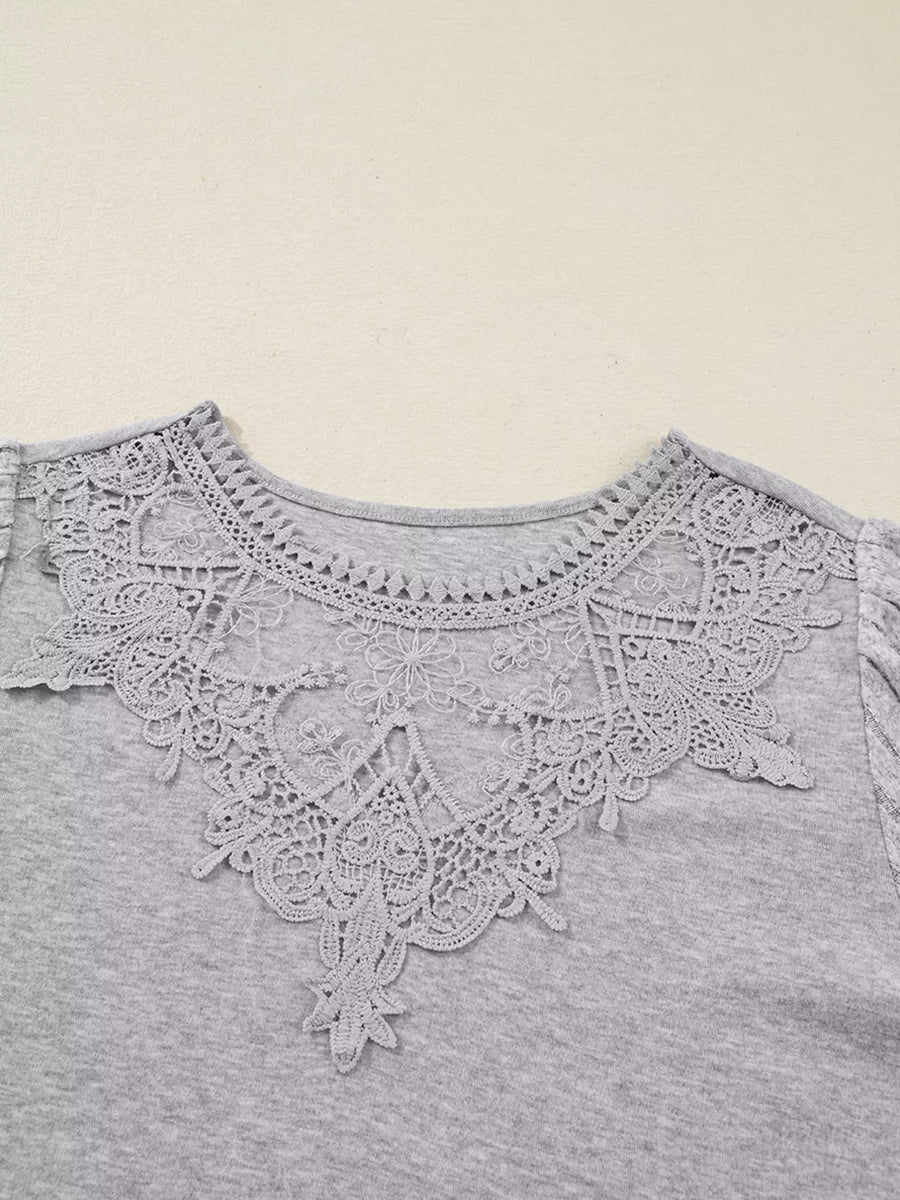 Gray ribbed knit long-sleeve top with intricate lace neckline detail