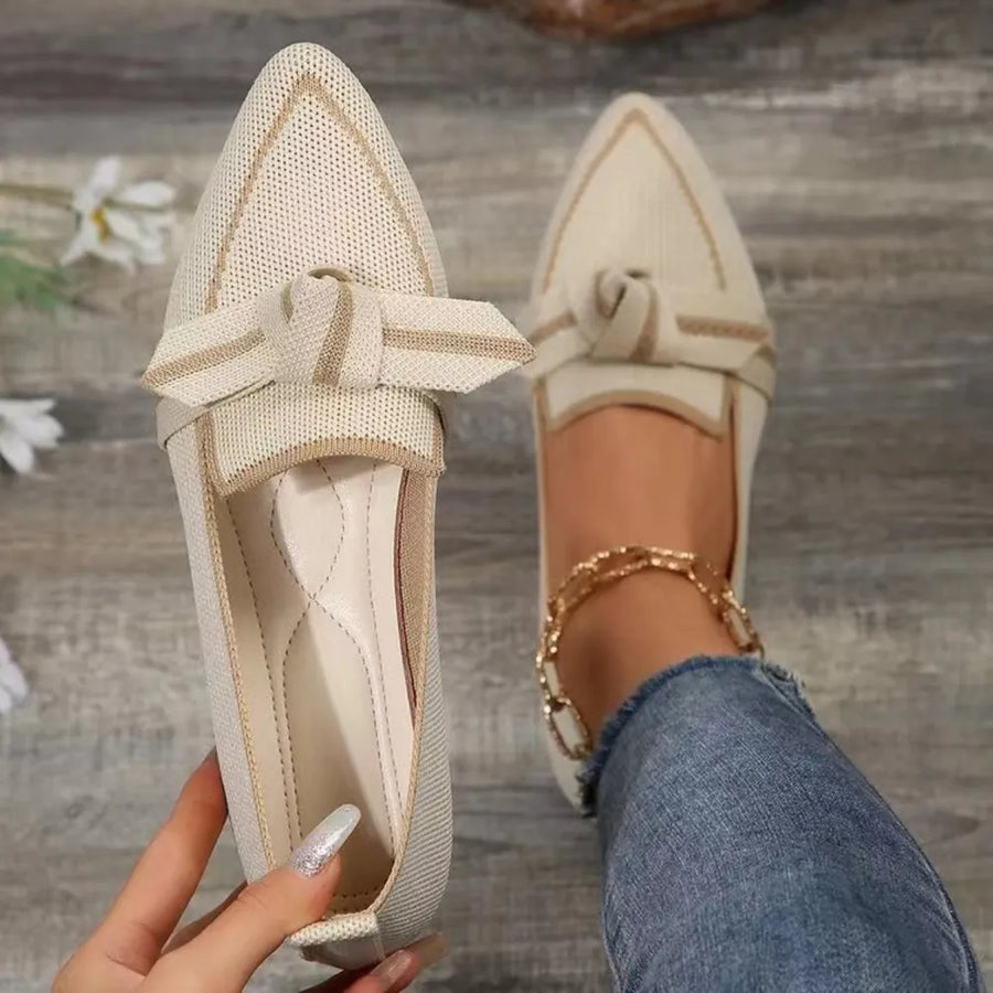 Knit bow loafers in ivory with contrast trim and pointed toe.