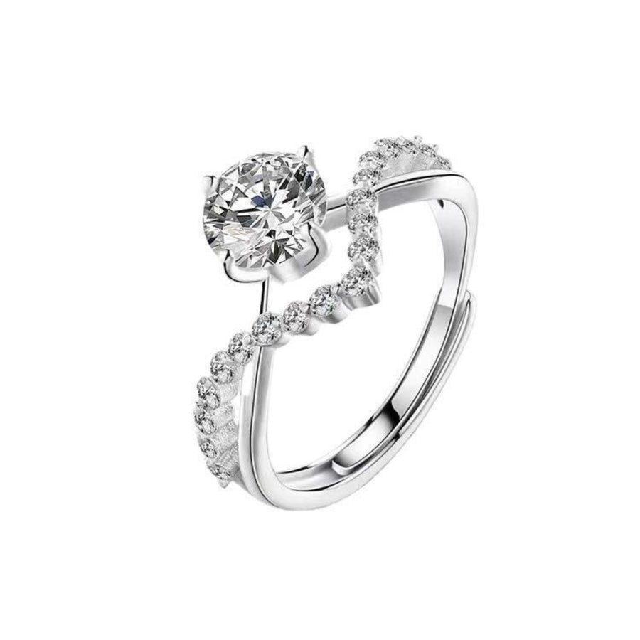 Sterling silver ring with moissanite and accent stones, adjustable band.