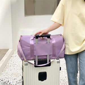 Sport Luxe Weekend Holdall duffel bag in Pink Purple with trolley sleeve and shoulder strap.