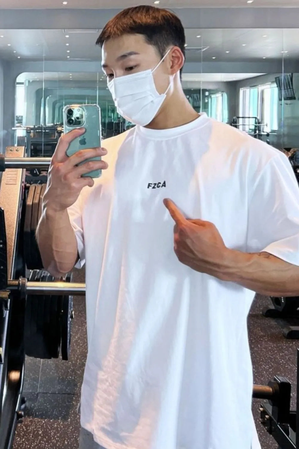 White oversized tee with drop shoulder and black logo detail