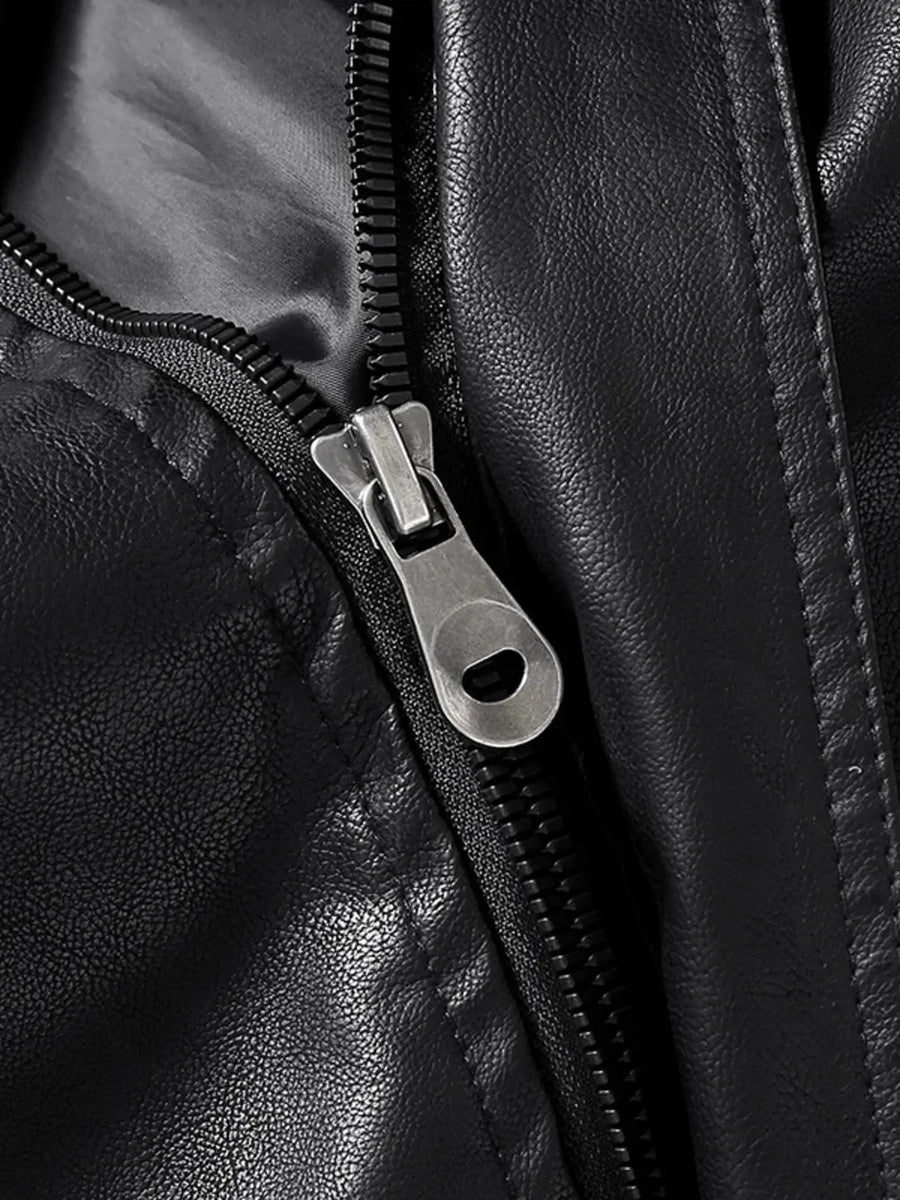 Black faux leather zip-up jacket detail with silver zipper pull.