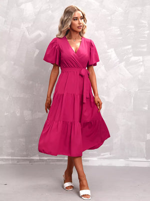 Hot Pink tiered midi dress with flutter sleeves and a belted waist.