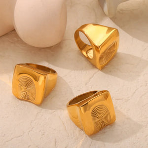 Gold signet ring with sculpted fingerprint detail