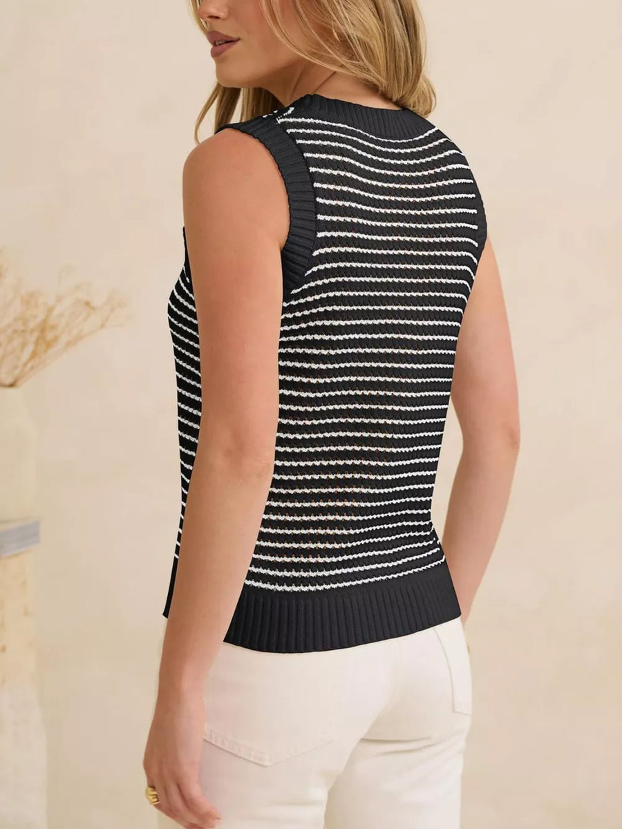 Textured striped knit sweater vest in black and white with a ribbed hem.