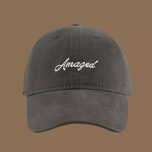 Grey cotton baseball cap with embroidered "Amazed" text.