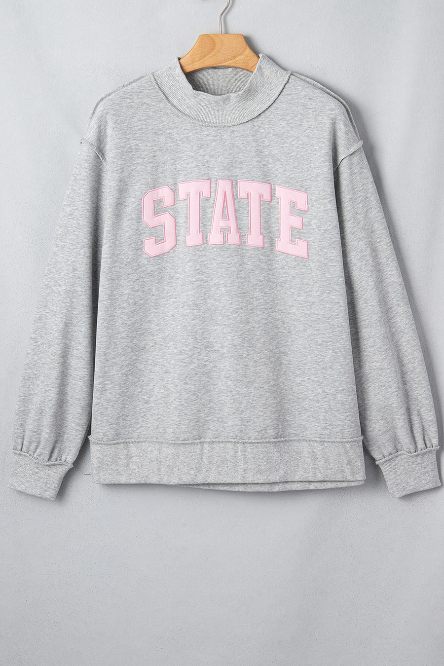 light gray sweatshirt with hip-length and pullover