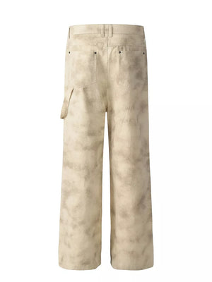 Men's beige wide-leg sweatpants with distressed finish and utility pocket.