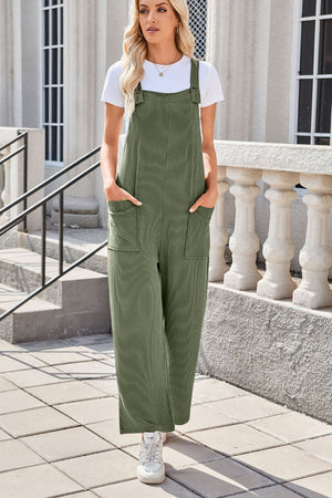 Moss green striped denim overalls with patch pockets and wide legs.
