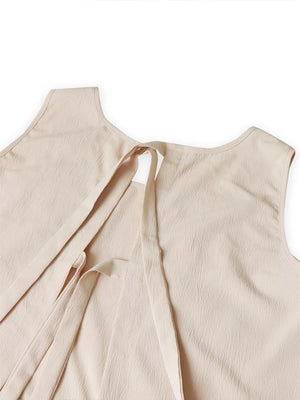 Scalloped trim tank top with tie closure and textured fabric.