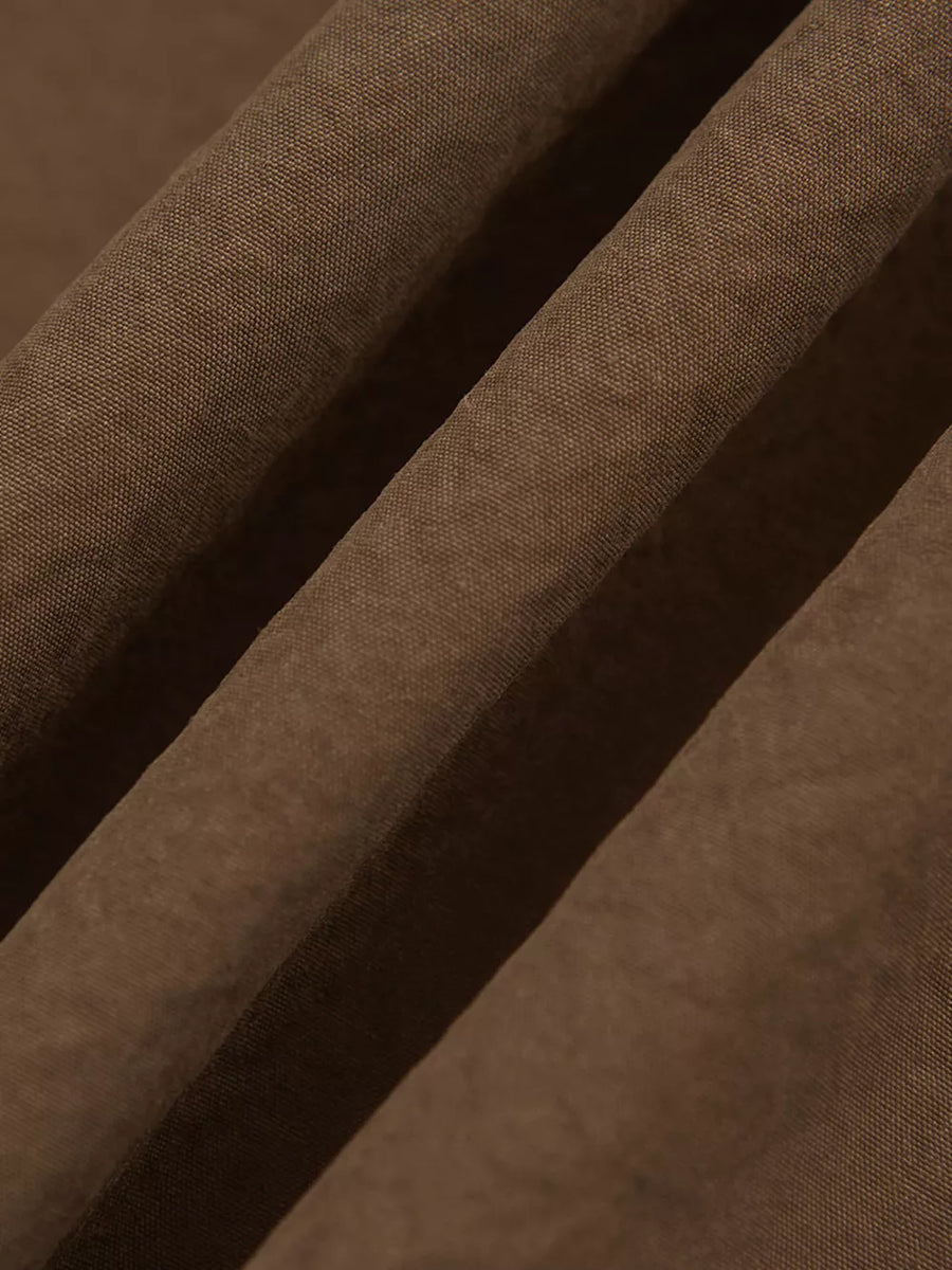 Brown relaxed fit sweatpants with side stripe detail.