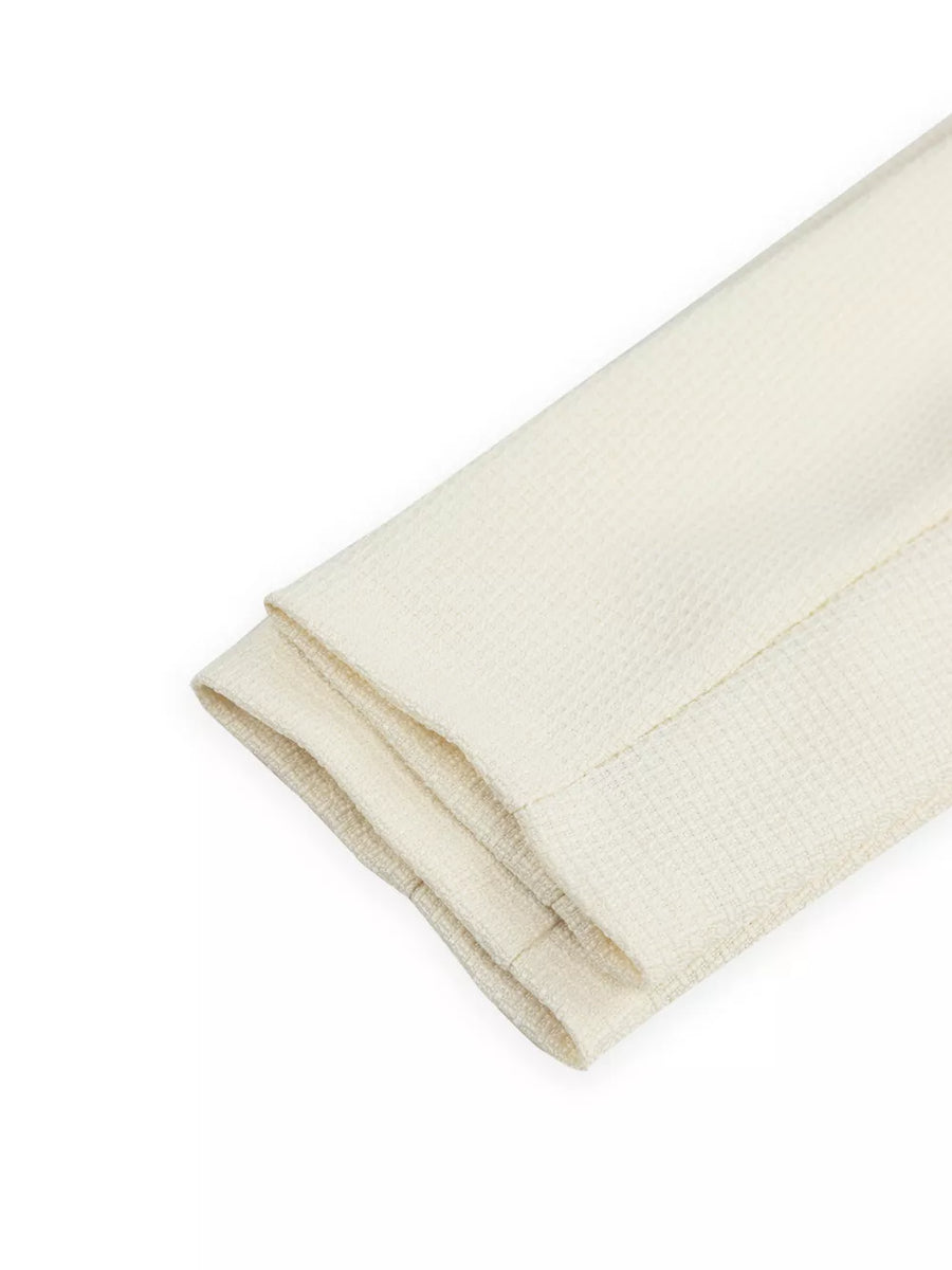 Cream waffle knit fabric with folded hem detail