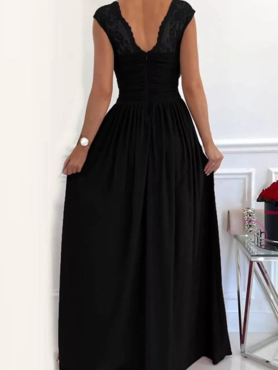 Black lace accent maxi dress with ruched bodice and flowing skirt.