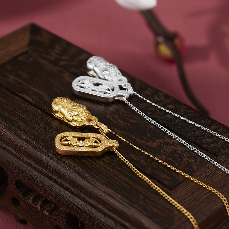 silver necklace featuring pendant and symbolic