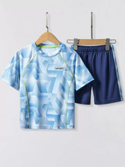 Toddler boys' blue geometric print t-shirt and navy shorts set with lime green trim.