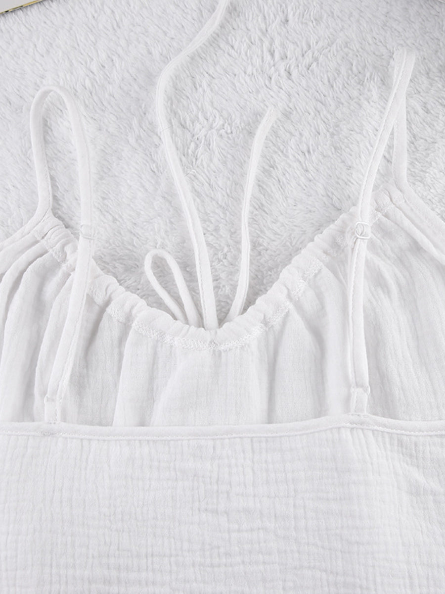 White cotton cami pajama top with adjustable straps and drawstring detail