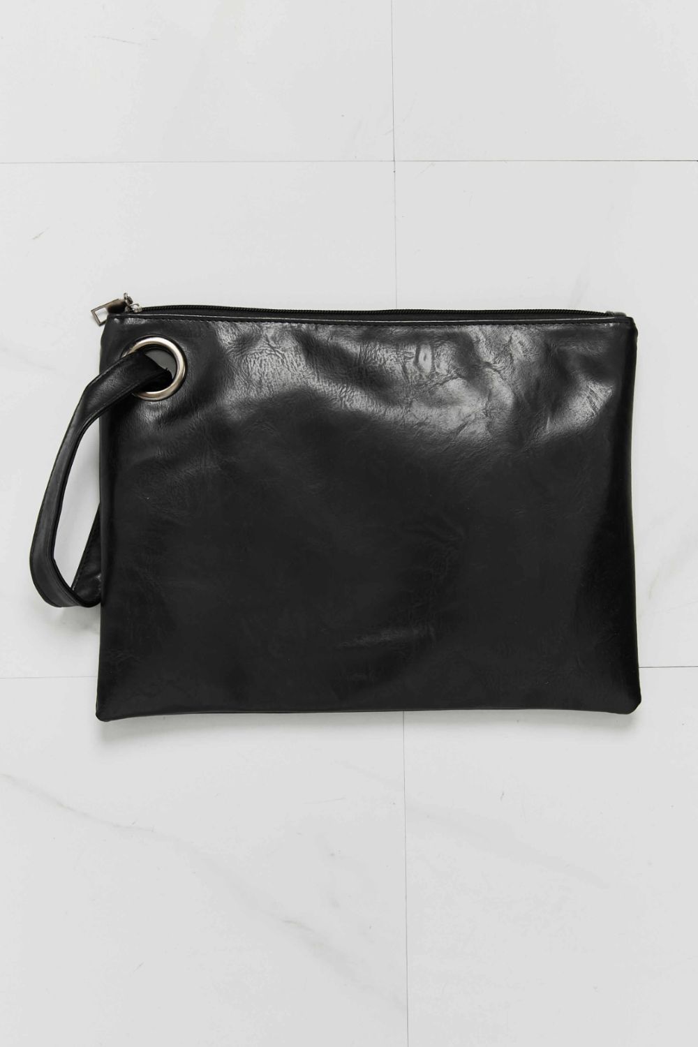 Black textured PU ring-handle clutch bag with zipper closure.
