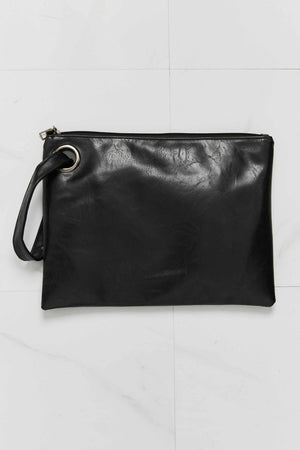 Black textured PU ring-handle clutch bag with zipper closure.