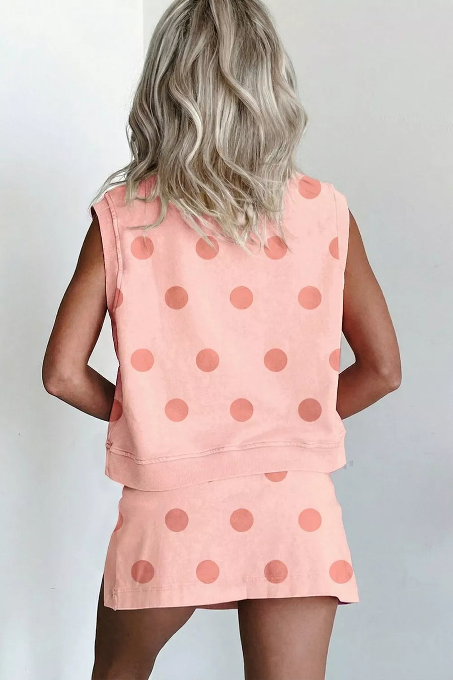 Polka dot two-piece set in watermelon pink, sleeveless crew neck top and skort.