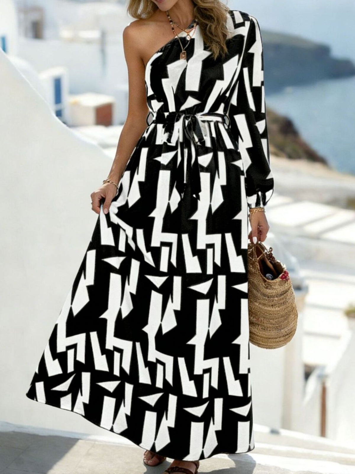 black maxi dress with geometric and one-shoulder