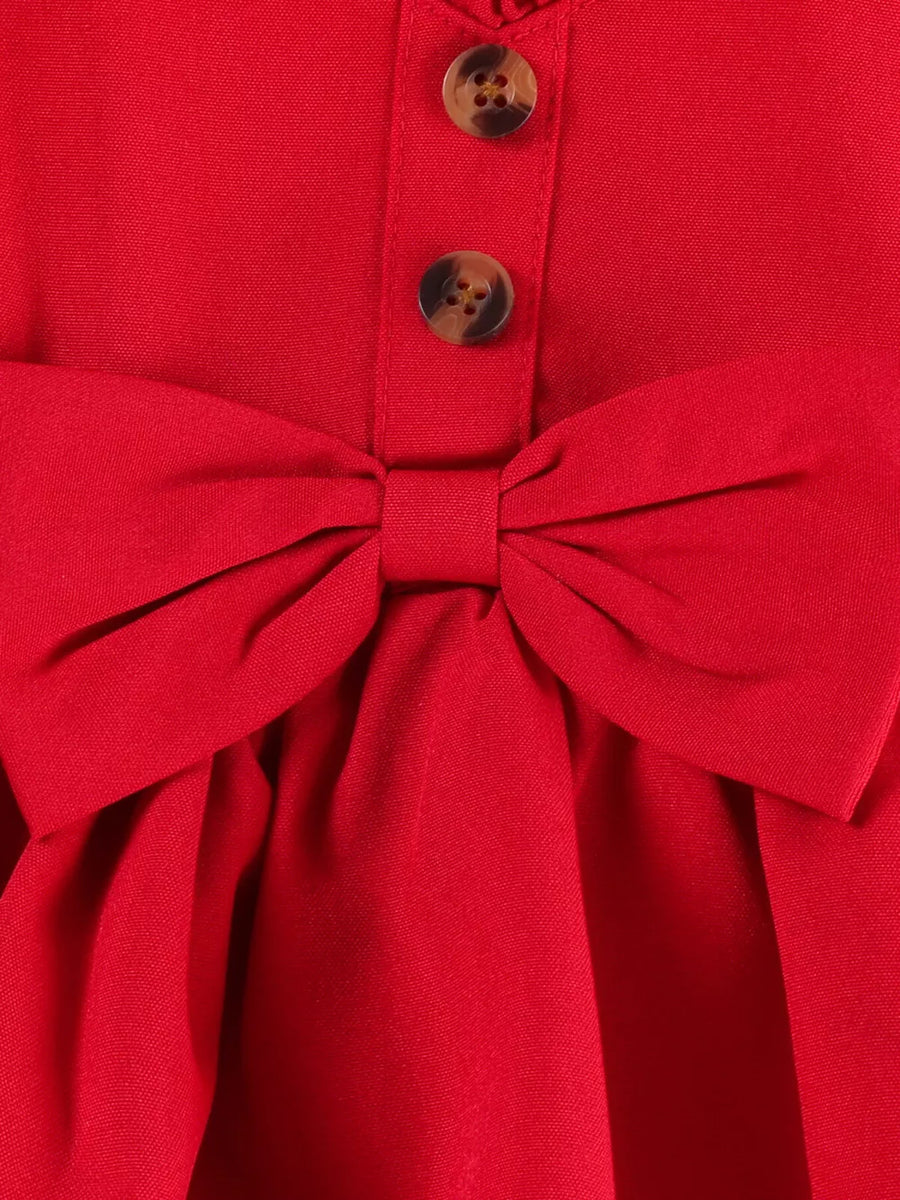 Red baby top with bow detail and button front, part of a set with denim shorts.