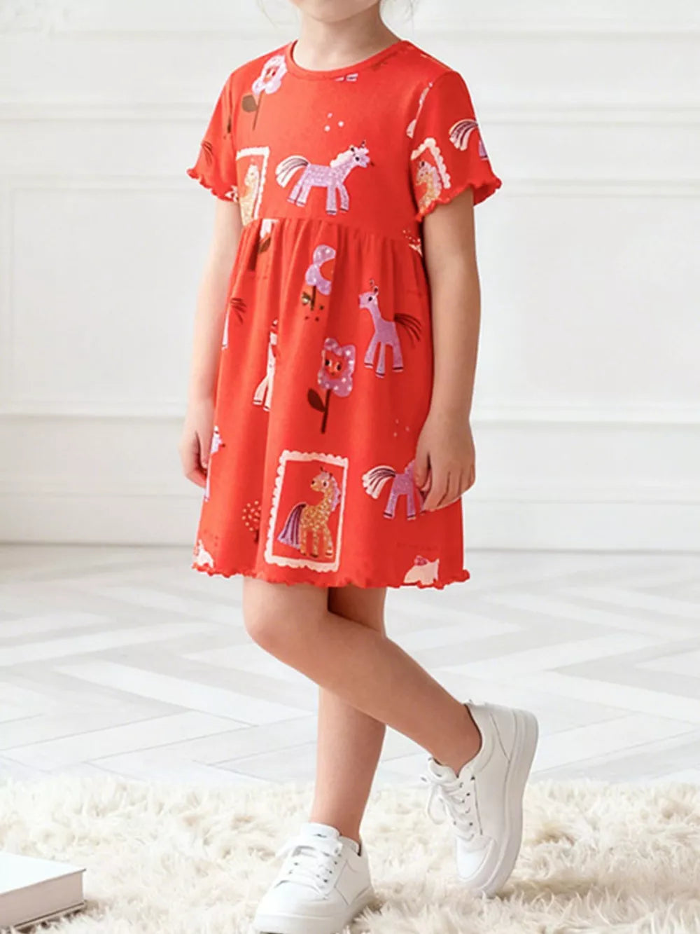 Red cotton blend toddler dress with whimsical horse print, short sleeves, and lettuce trim hem.