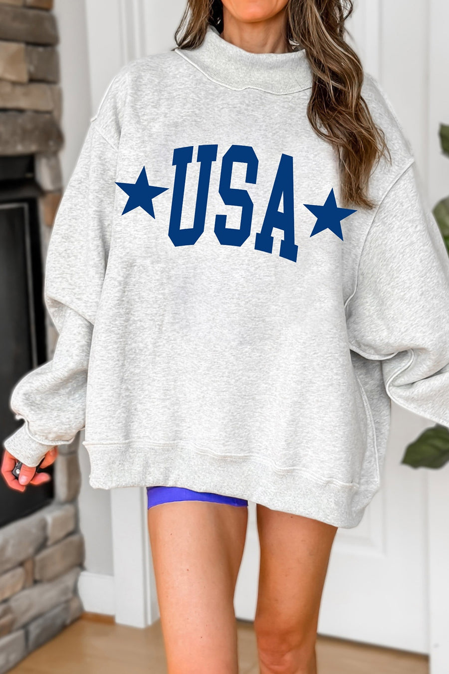 65% polyester, 35% cotton Care instructions: Machine wash cold sweatshirt in Light Gray with oversized silhouette