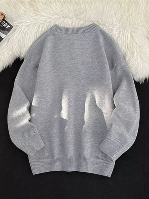 Light gray ribbed long-sleeve knit sweater with button detail