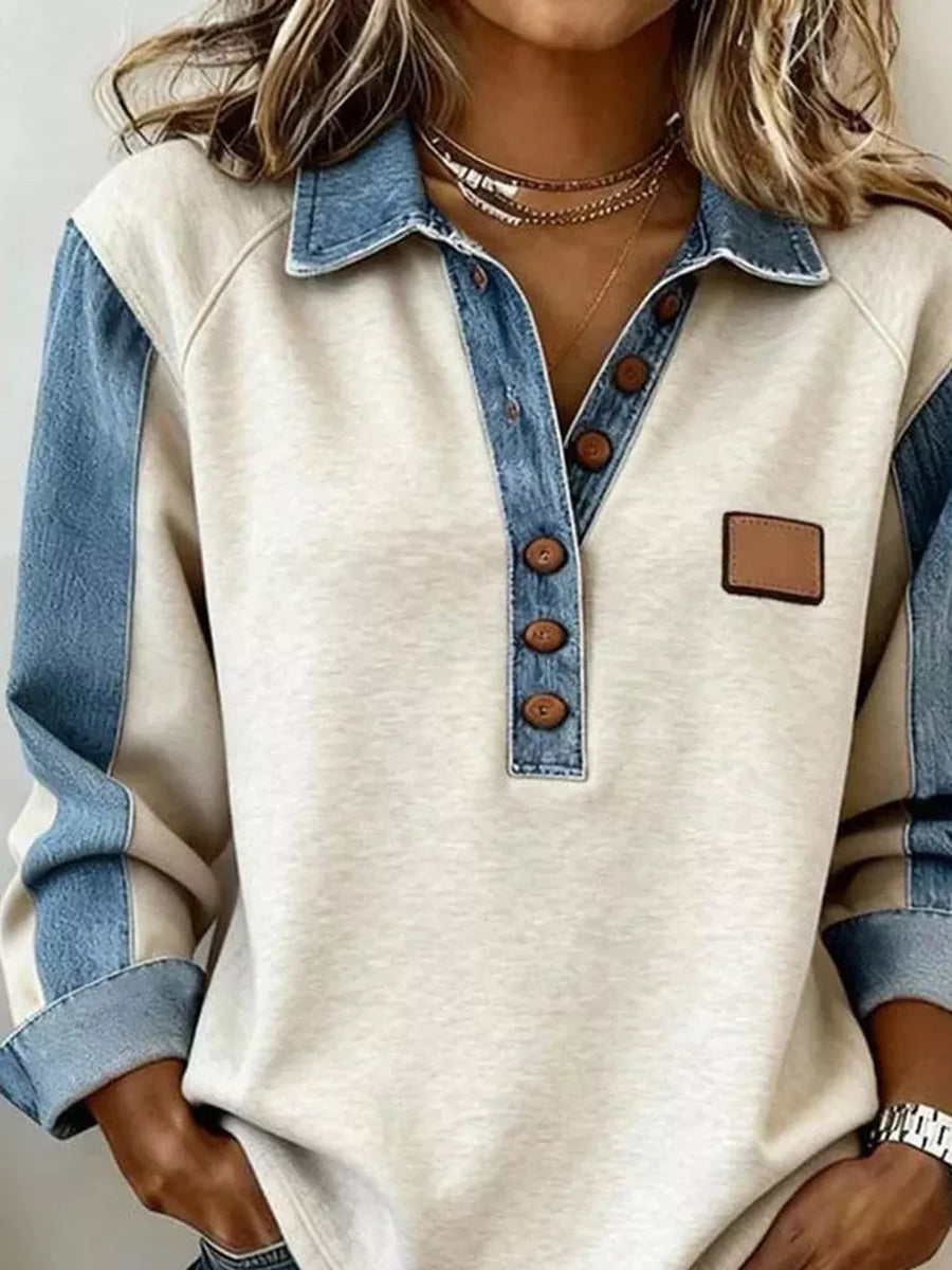 light blue polo shirt featuring buttoned and color-block