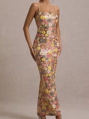 Maxi dress with floral sequin embellishments, square neckline, and spaghetti straps.