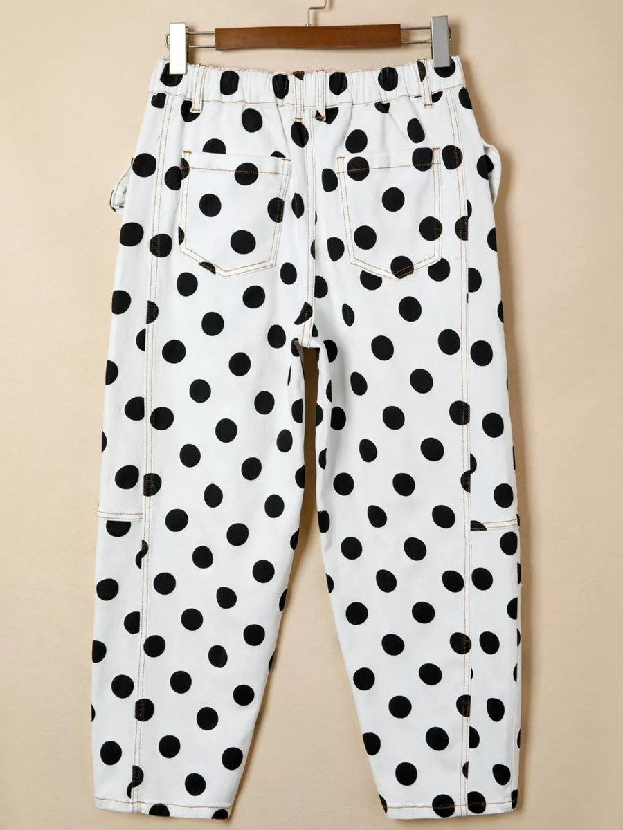 White polka dot denim jeans with high waist and bow details.