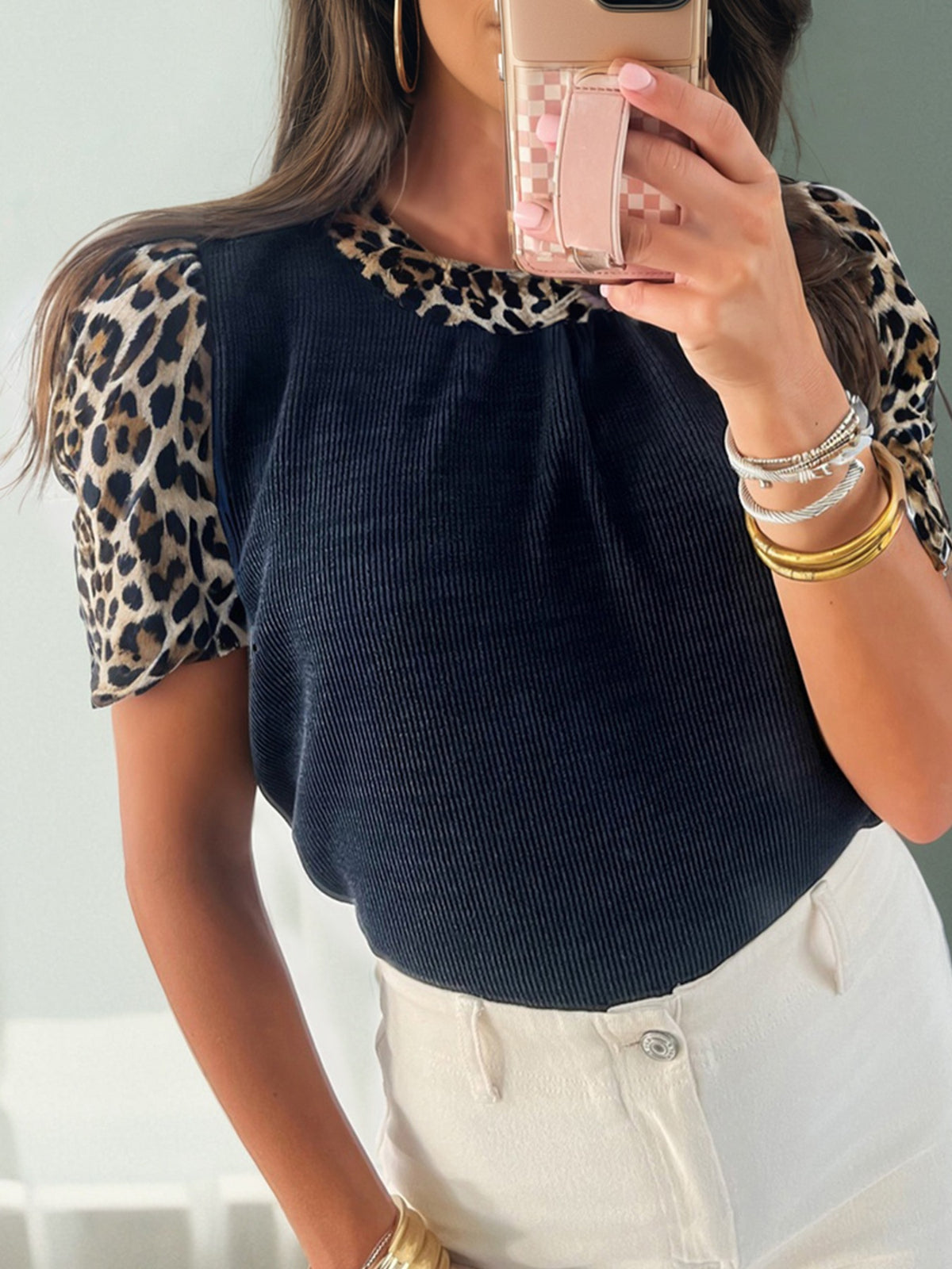 Leopard print short sleeve t-shirt with dark ribbed body and crew neck.