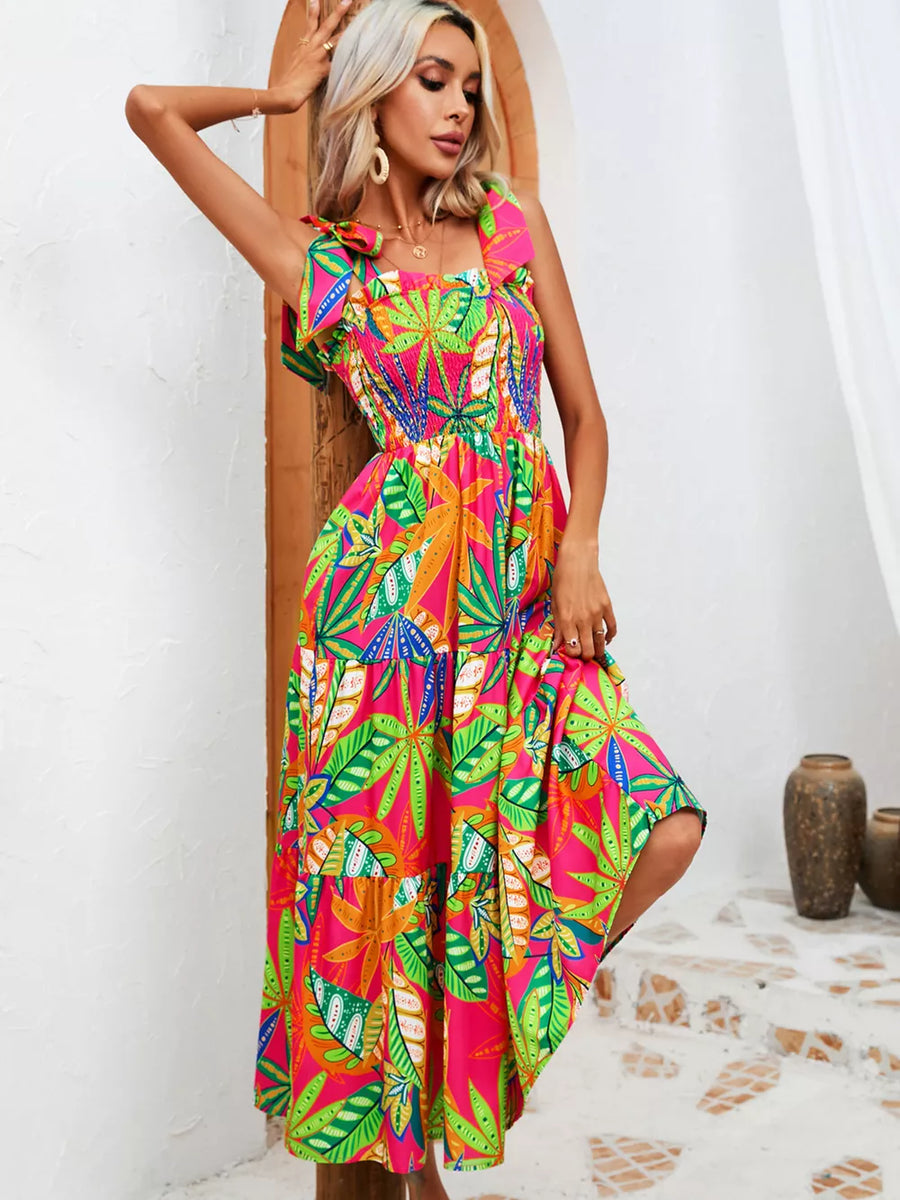 Tropical tie-strap smocked midi dress in pink with green leaf print, tiered skirt
