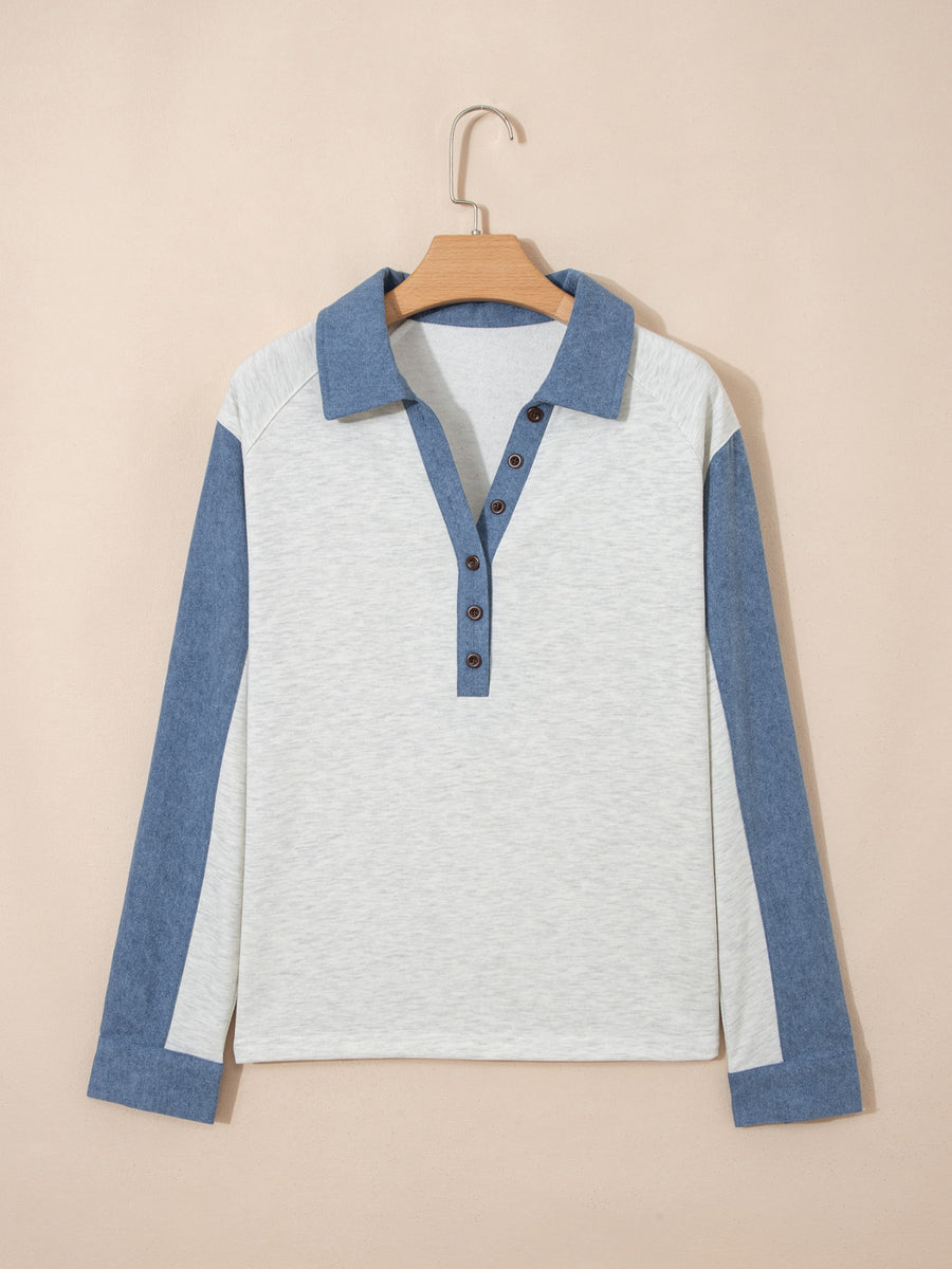 Heathered casual long sleeve top with button detail and color-blocked blue sleeves.