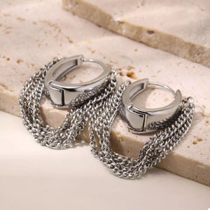 Silver chunky chain hoop earrings with layered chains.