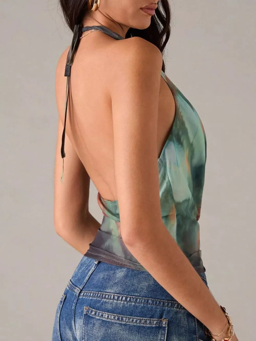 100% polyester Care instructions: Machine wash cold halter top in rust with fitted silhouette