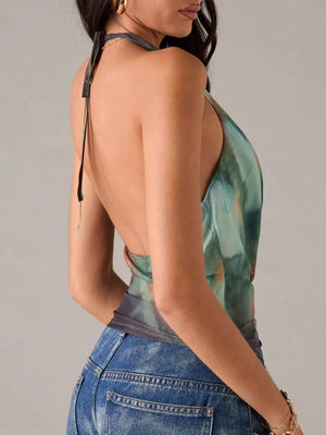 100% polyester Care instructions: Machine wash cold halter top in rust with fitted silhouette