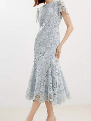 Light blue floral lace mermaid evening gown with cap sleeves and scalloped hem.
