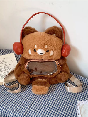 Mini plush cat backpack bag in caramel with red headphones and clear front pocket