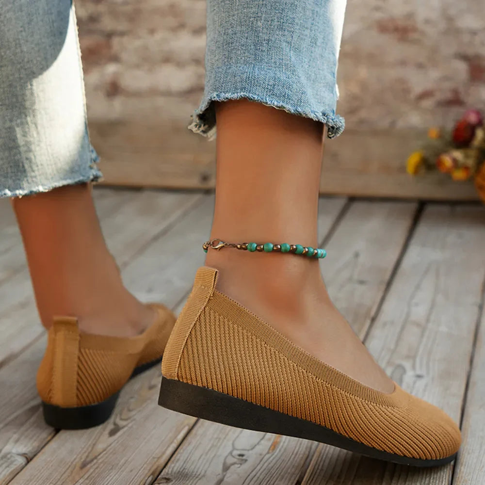 Khaki textured knit slip-on flats with a round toe and black sole.