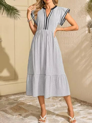 Striped midi dress with notched V-neck, ruffle sleeves, and tiered hem.