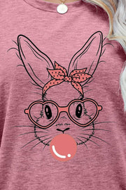 Dusty Pink t-shirt with a graphic bunny wearing glasses and a polka dot bow, blowing a bubble.