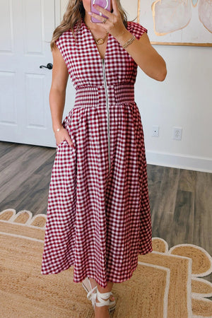 Gingham zip-front midi dress in cerise with elastic waist and pockets.