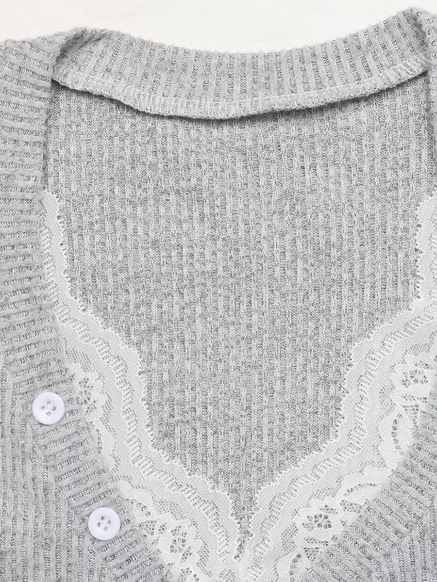 Gray ribbed knit v-neck top with white lace trim and two white buttons