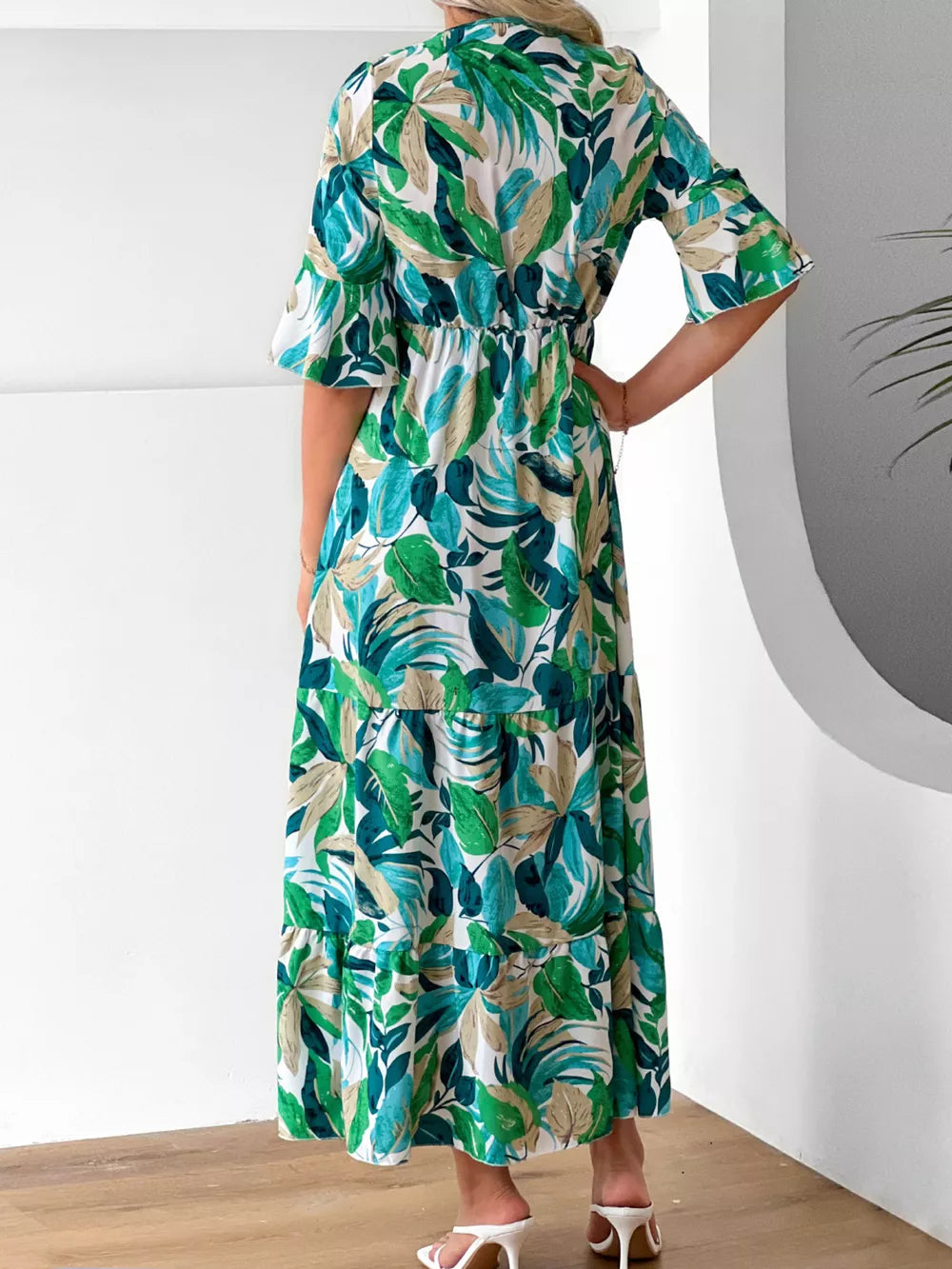 100% polyester Care instructions: Machine wash cold midi dress in teal with A-line silhouette