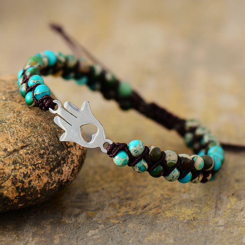 Turquoise bead bracelet with Hamsa hand charm and heart cutout, macrame cord detail