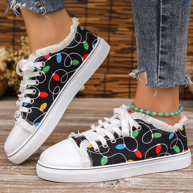 Black canvas sneakers with string light pattern and fringe trim