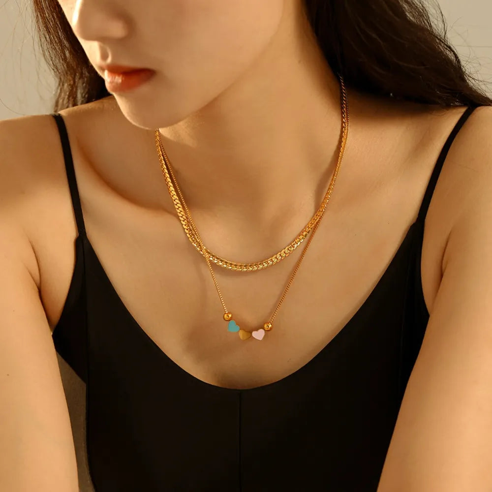 Gold double layered necklace with small colorful heart charms